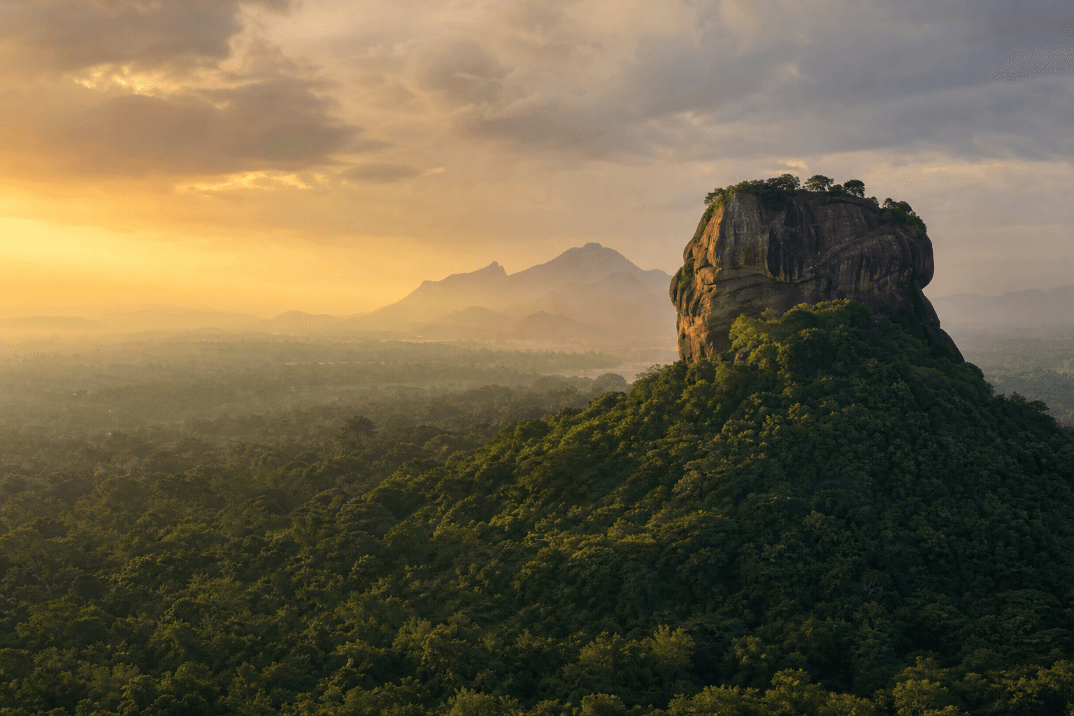 Sigiriya rising above Sri Lanka's tropical landscape at sunrise